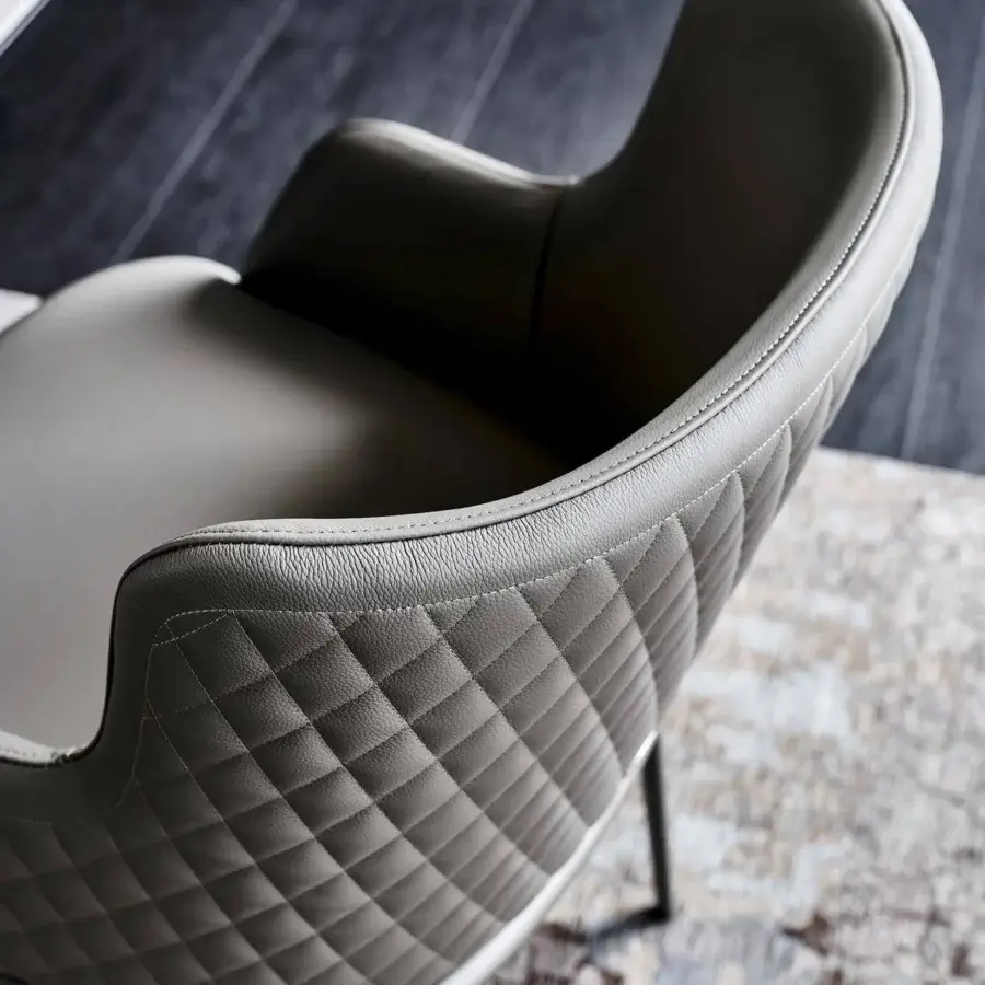 Exceptional Cattelan Italia Magda ML Couture chair with light grey upholstery and diamond quilting built with a slender metal base