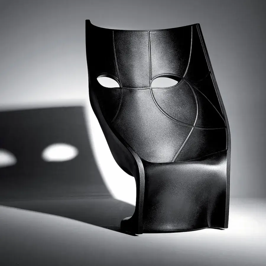 Avant-garde Driade Nemo Lounge chair sculpted in glossy black polyethylene with a dramatically curved monolithic form