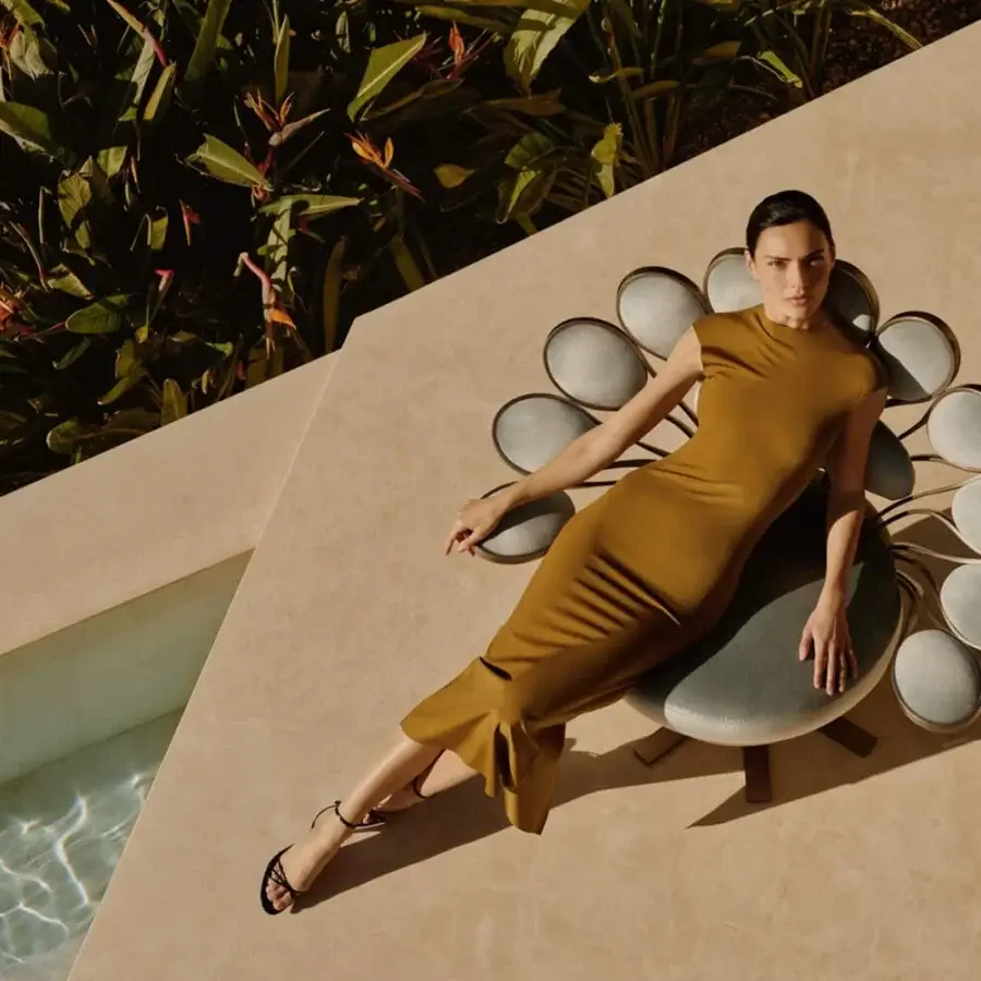 Captivating Visionnaire Pavone Outdoor lounge chair with curved aluminum and warm brown textile upholstery in painted metal