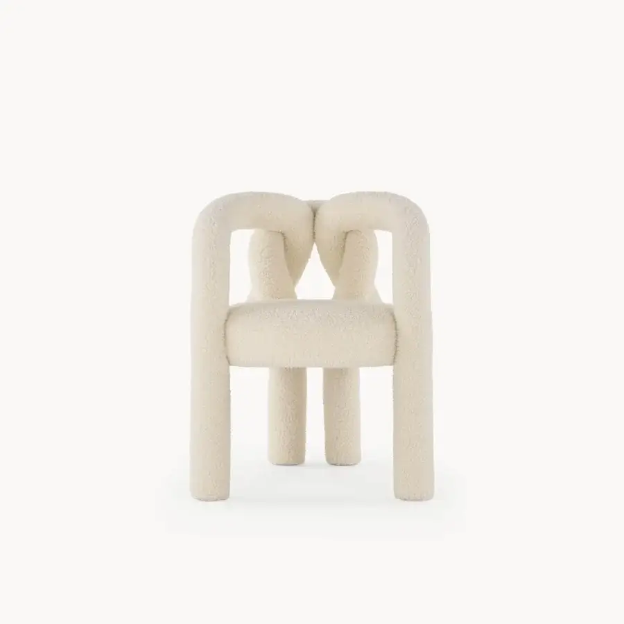 Superior Visionnaire Shibari chair with enveloping silhouette, soft textured bouclé fabric and uniform off-white finish