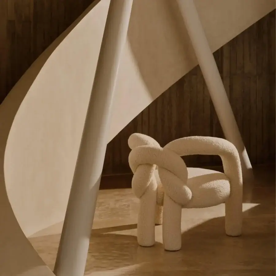 Innovative Visionnaire Shibari lounge chair with textured creamy beige recycled PET fabric and curved metal frame