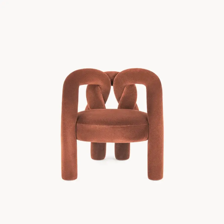 Distinguished Visionnaire Shibari lounge chair with curved tubular metal frame upholstered in textured reddish-brown stretch fabric and powder-coated finish