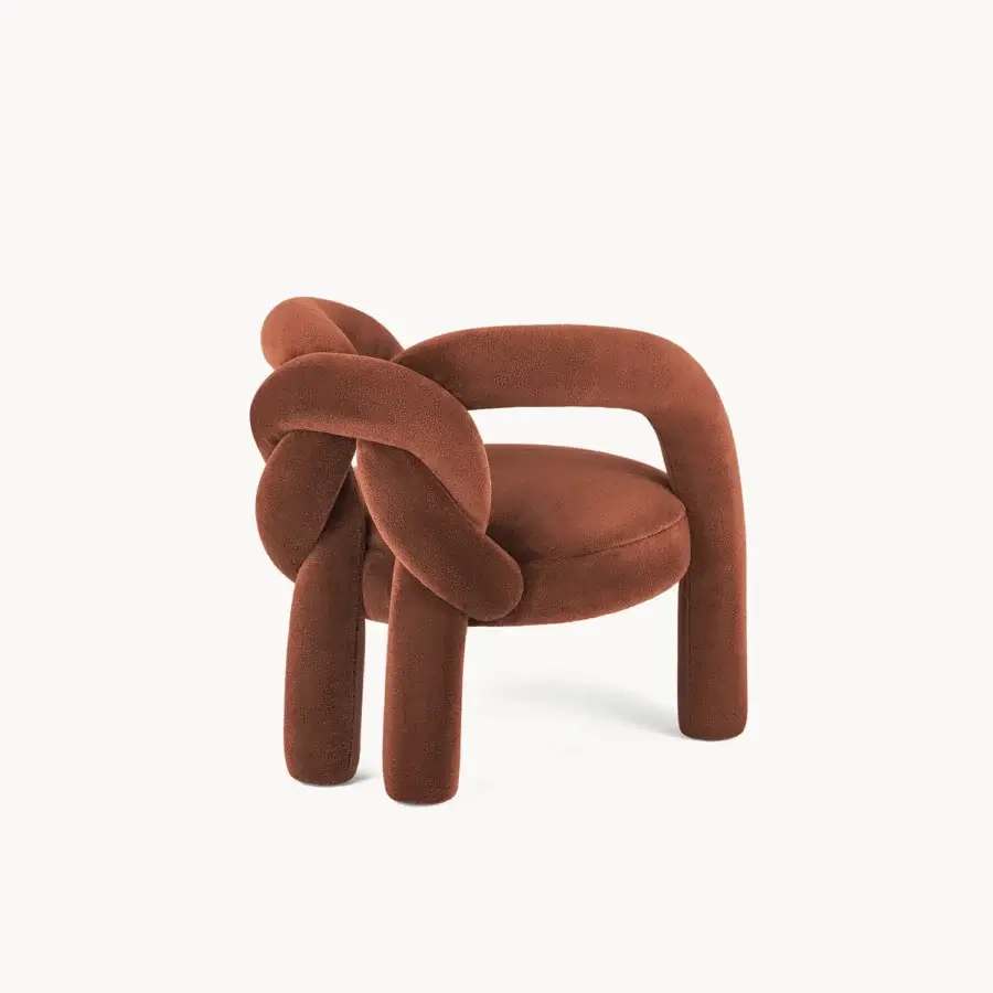Innovative Visionnaire Shibari lounge chair with interwoven design upholstered in reddish-brown recycled PET fabric and powder-coated finish