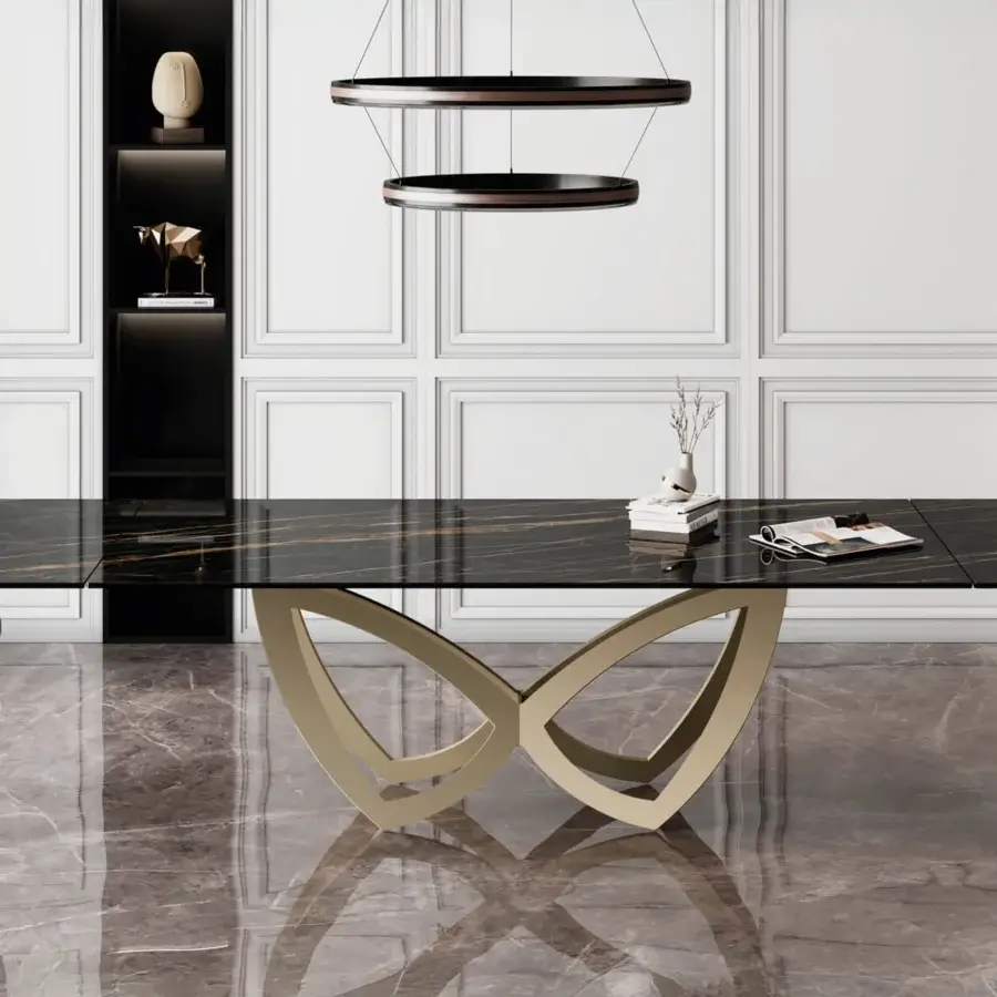 Distinguished Naos Par Par table with a dramatic black ceramic top and sculptural satin-finish metal base in a unique butterfly silhouette
