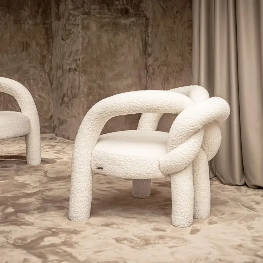 Distinguished Visionnaire Shibari lounge chair crafted with curved metal, textured off-white recycled PET fabric and powder-coated finish