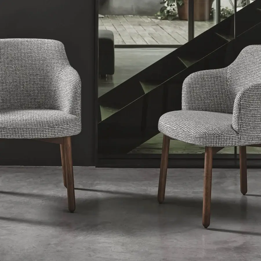 Distinguished Porada Abby chair with a solid Canaletto walnut frame and textured gray and white checkered fabric upholstery with satin finish