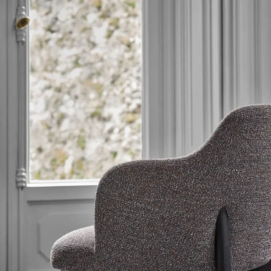 Superior Porada Abby chair with a solid Canaletto walnut frame and muted gray speckled textile upholstery