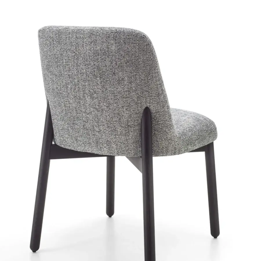 Superior Porada Abby chair with a gracefully curved Canaletto walnut frame and muted gray textured textile upholstery with a dark matte finish