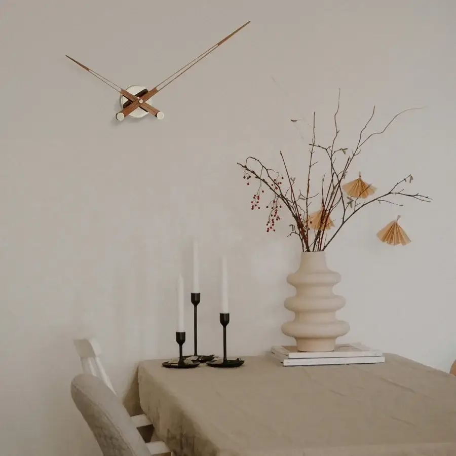 Superior Nomon Axioma wall clock crafted in wood with a matte finish and subtle grain patterns