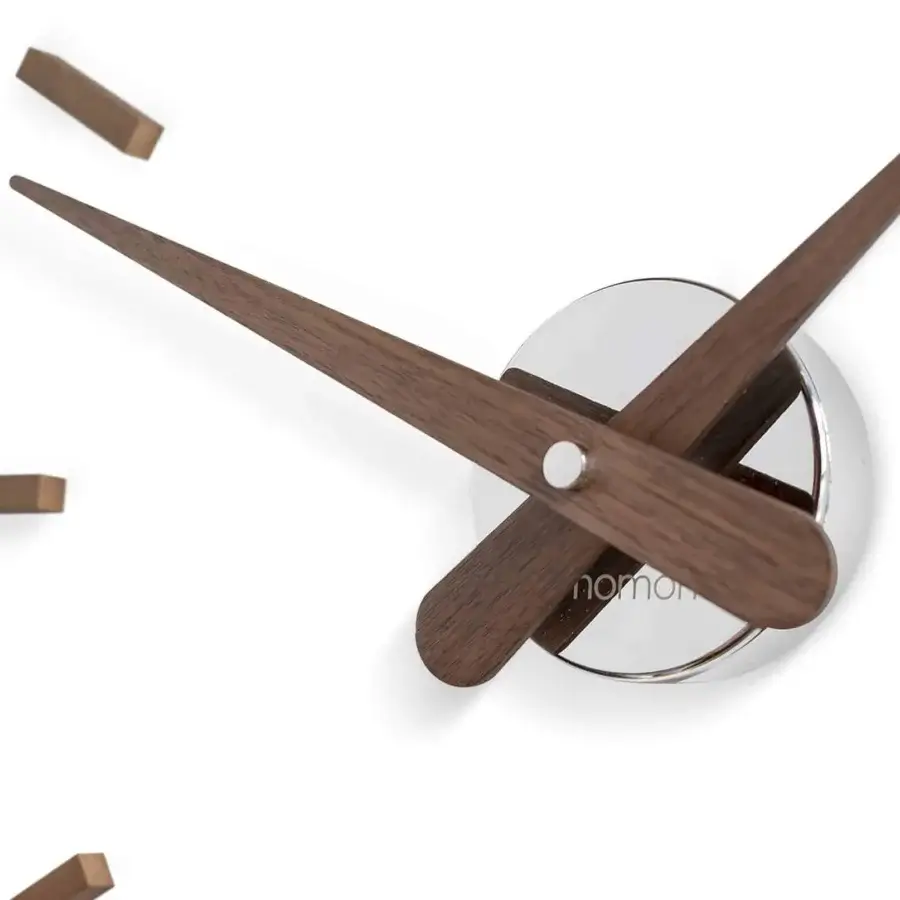 Distinguished Nomon Sunset wall clock crafted in wood with elongated hour markers and a polished silver center in satin finish