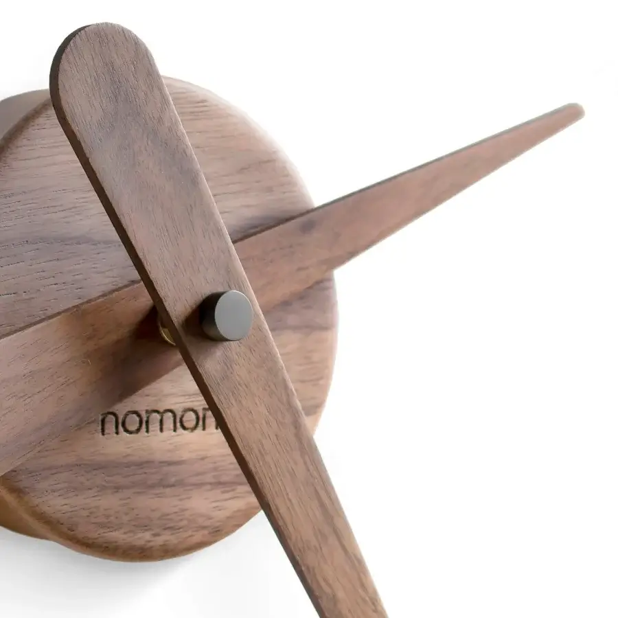 Superior Nomon Sunset wall clock crafted in wood with a smooth satin finish and elongated hour markers