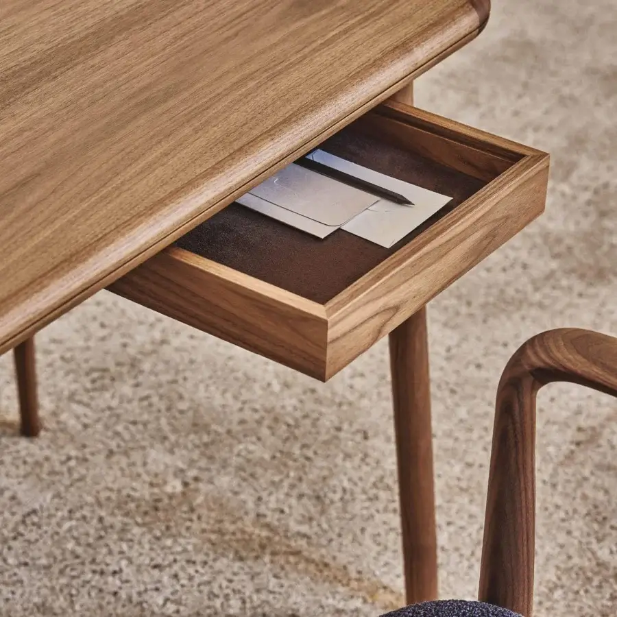 Distinguished Porada Aksel desk crafted in solid Canaletto walnut with satin finish and a unique two-part tabletop design