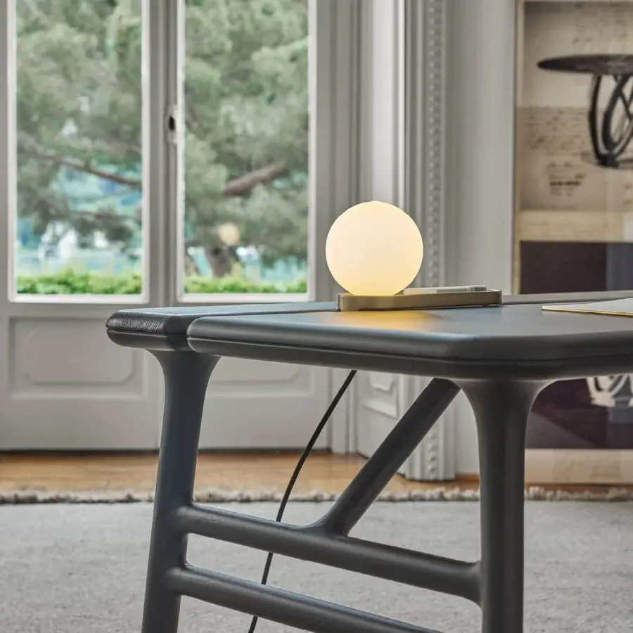 Elegant Porada Aksel desk crafted in solid Canaletto walnut with a Plus leather top and functional cable management