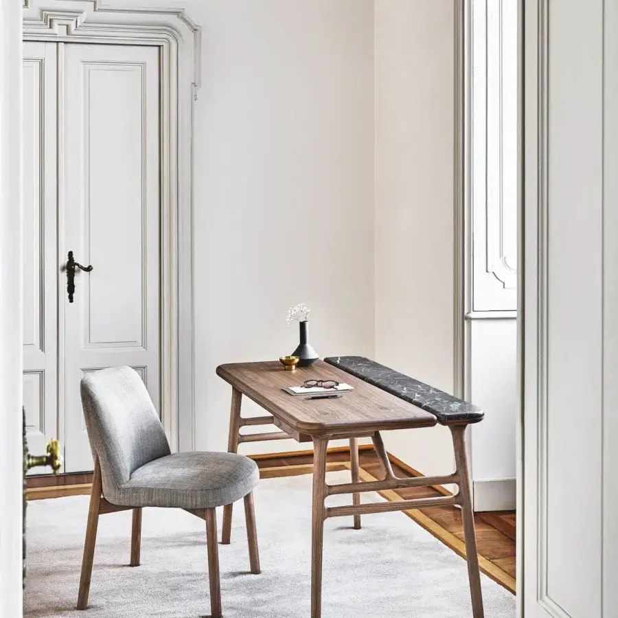 Distinguished Porada Aksel desk crafted in solid Canaletto walnut with a dark marble insert and satin finish
