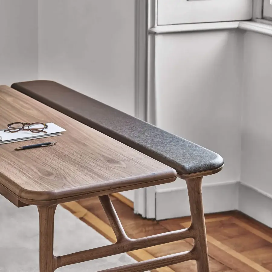 Exceptional Porada Aksel desk in solid Canaletto walnut and darker inset, showcasing a satin finish with cable management details