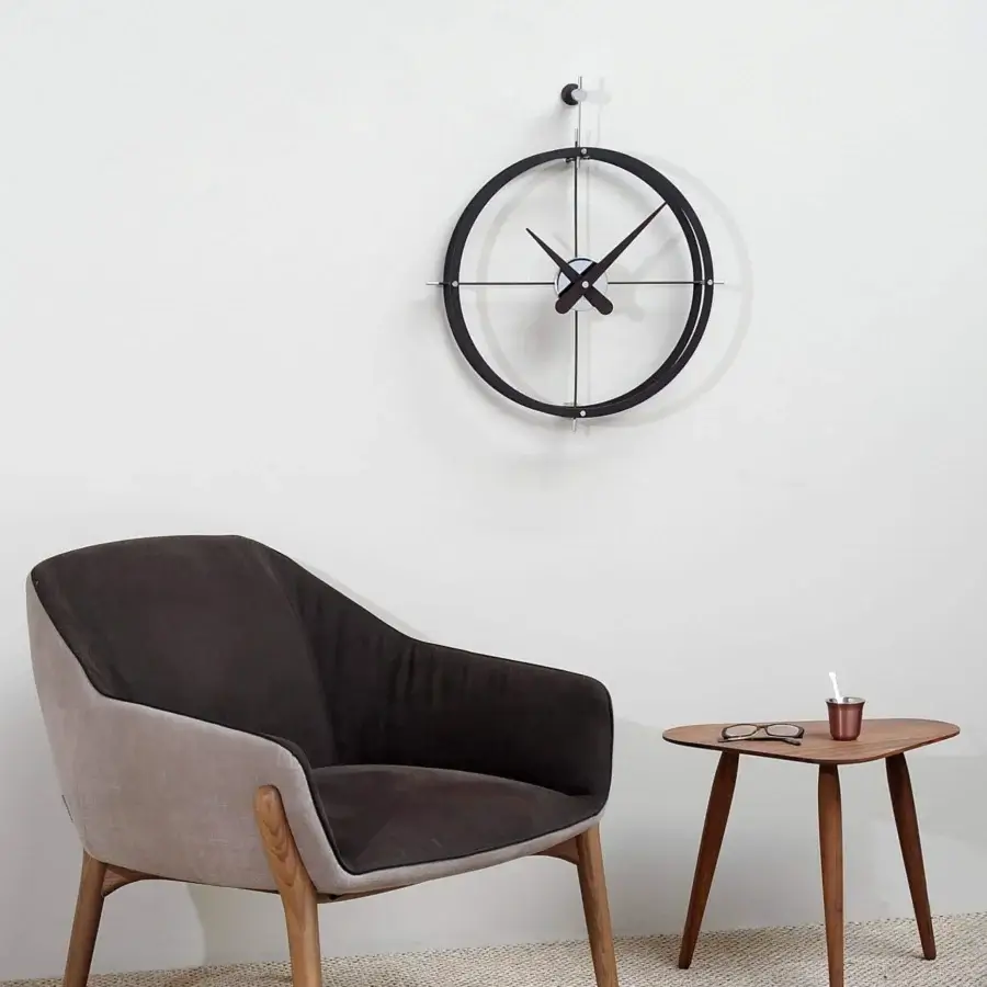 Captivating Nomon Dos Puntos wall clock with double rings crafted in polished steel and sleek black hands with matte finish