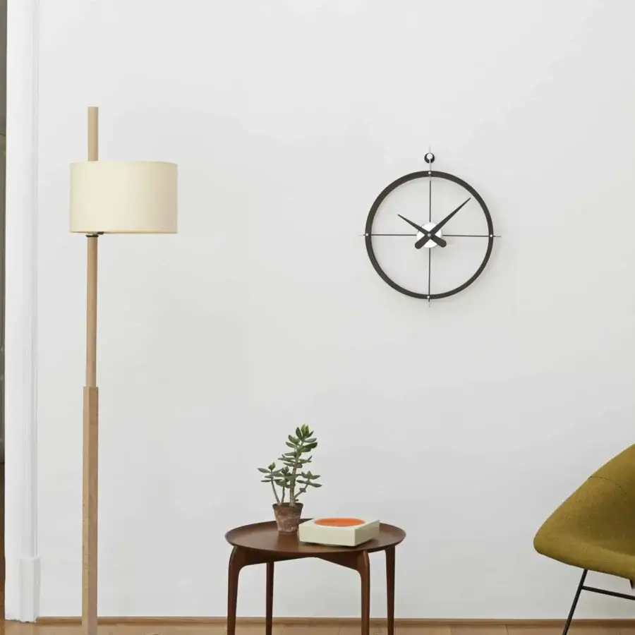 Elegant Nomon Dos Puntos wall clock with a balanced composition crafted in polished steel and dark gray