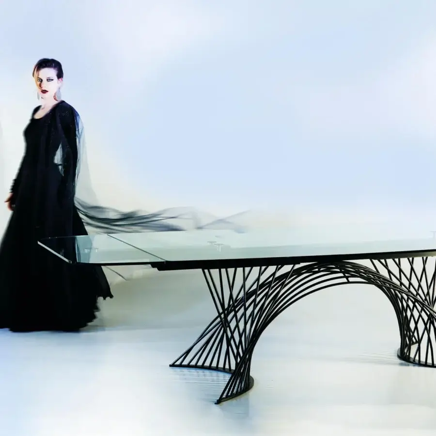 Distinguished Naos Latour table with a glass tabletop and painted metal base offering a dark matte finish