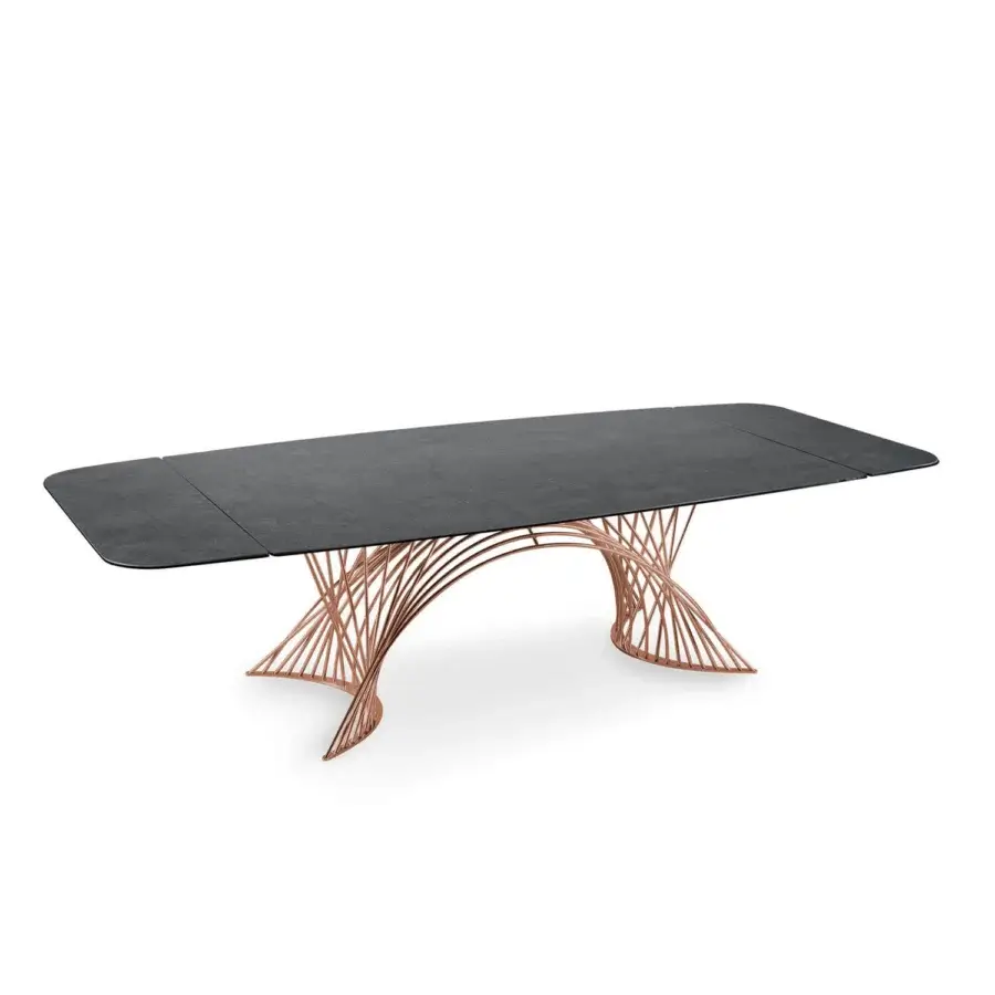 Superior Naos Latour table with dark ceramic tabletop and dramatically sculptural painted metal base displaying a warm coppery satin finish
