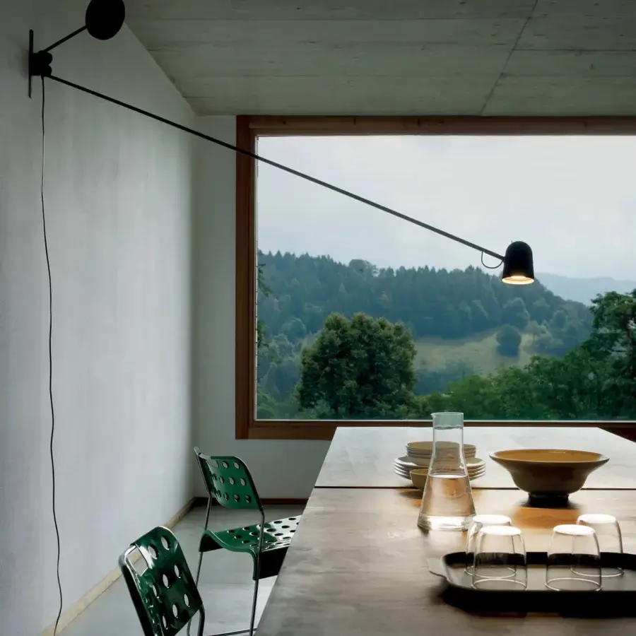 Exceptional Luceplan Counterbalance wall lamp crafted in matte black painted steel with a sleek aluminum head