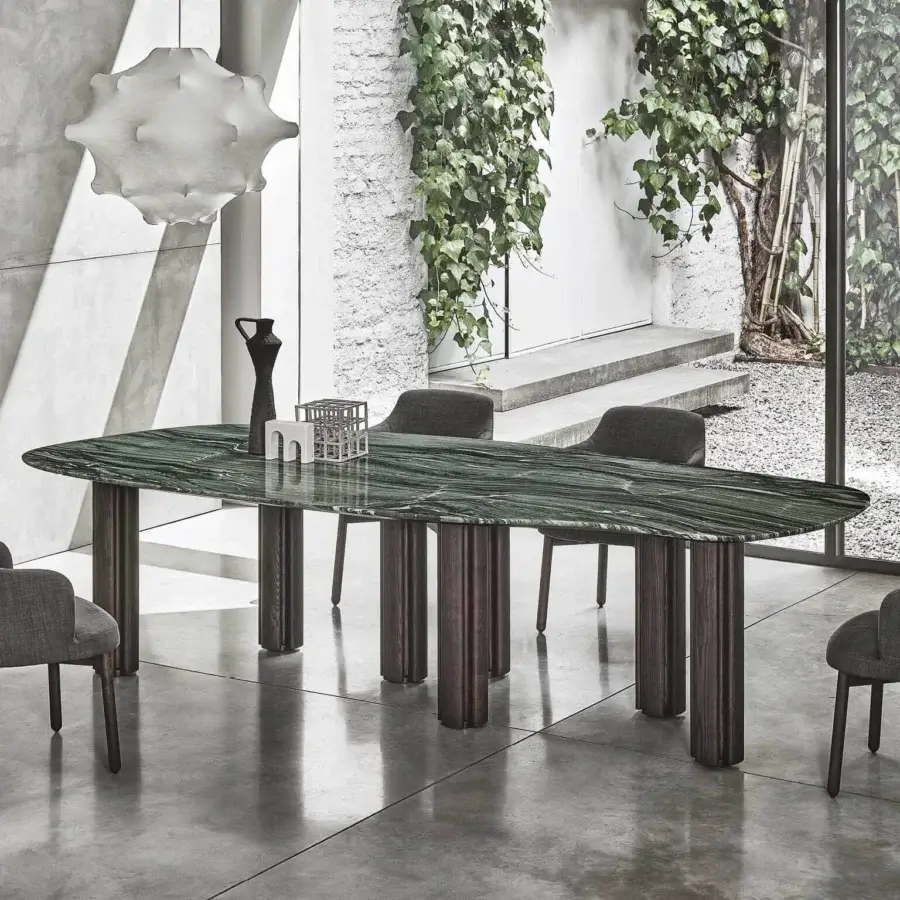 Distinguished Porada Berry table with vibrant green marble and uniquely fluted dark matte wooden legs