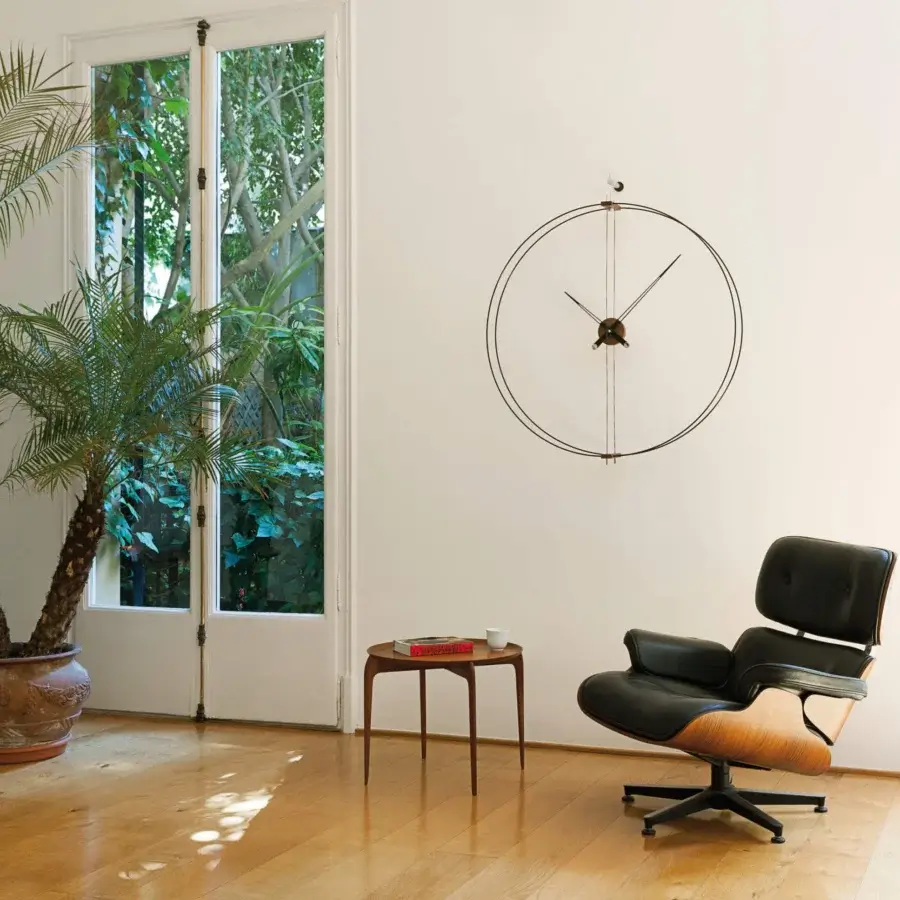 Elegant Nomon Barcelona wall clock with a double ring in black fiberglass and walnut elements with a matte finish
