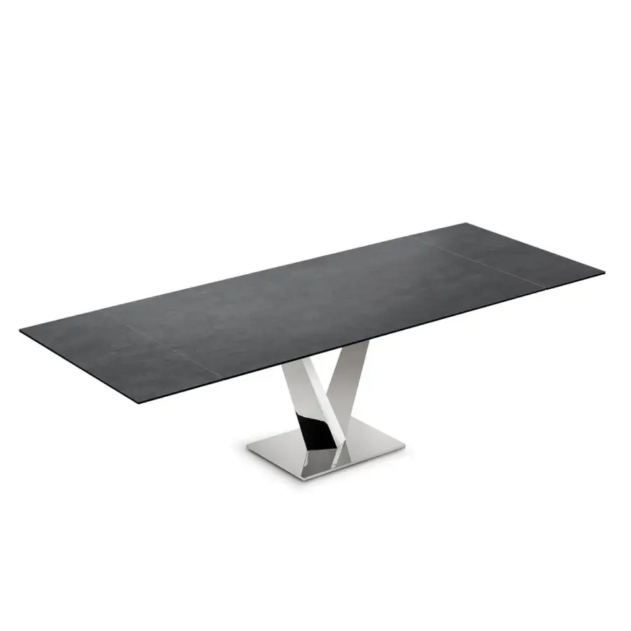 Distinguished Naos Minosse table with dark gray textured ceramic top and polished silver v-shaped metal base crafted in Italy