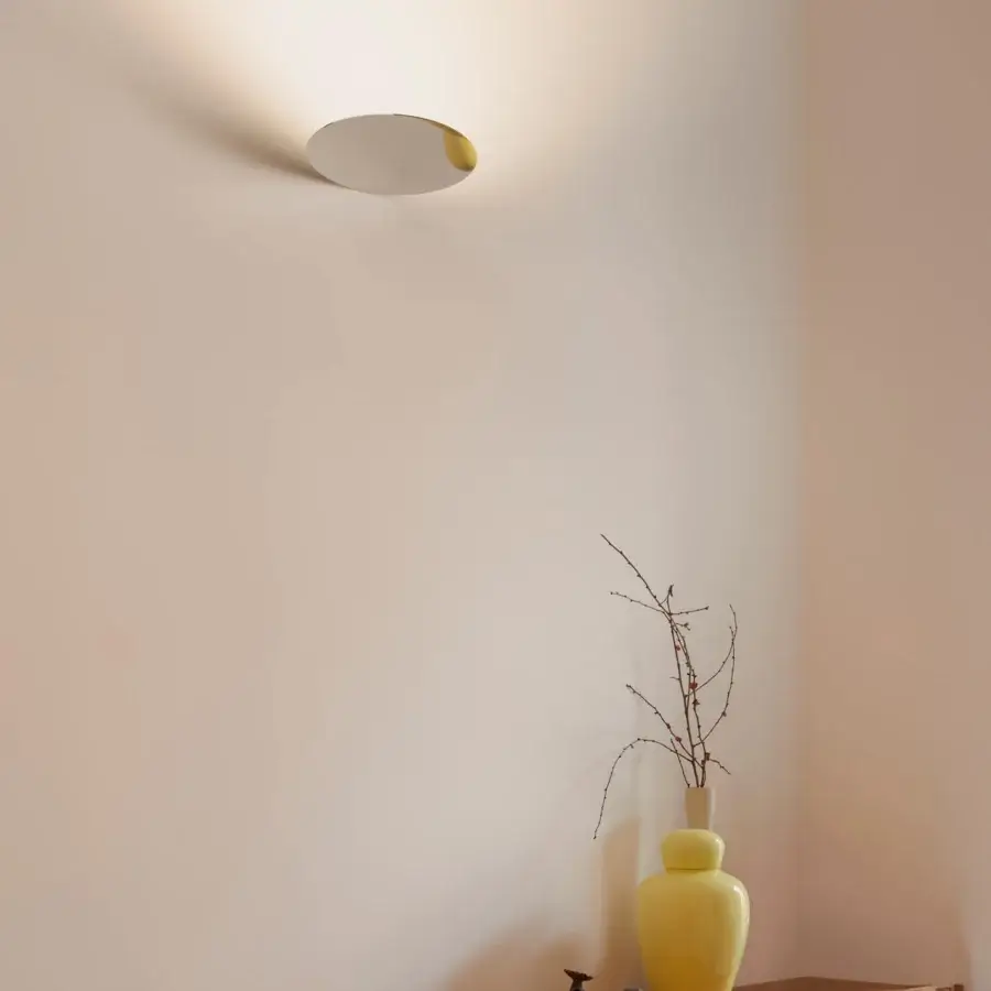 Superior Luceplan Millimetro wall lamp with a uniform light beige surface and polished mirror-finish metal construction