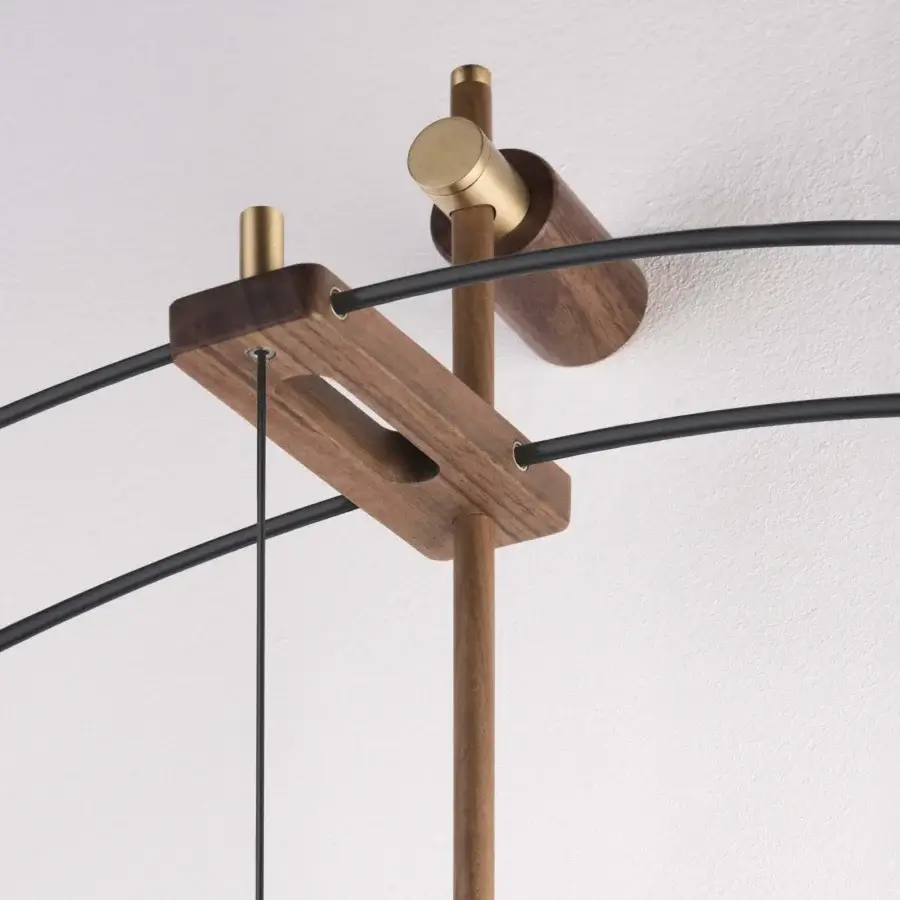 Distinguished Nomon Barcelona Premium wall clock crafted with polished brass and warm wood tones exhibiting a complex geometric form