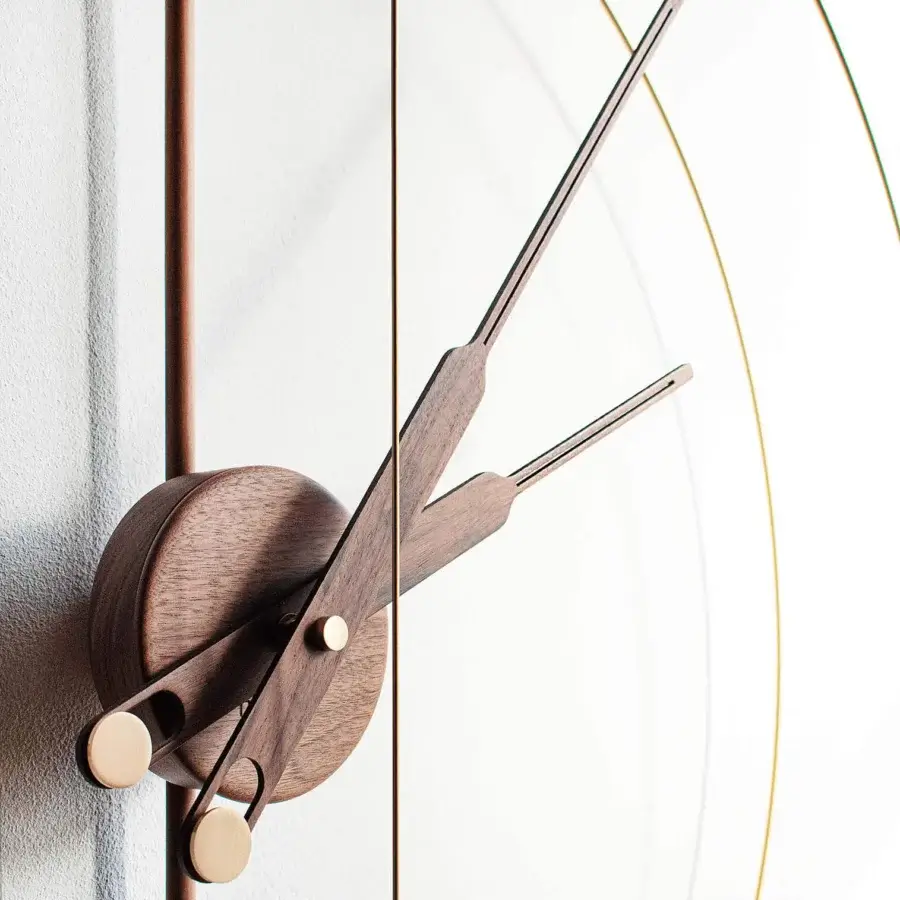 Superior Nomon Barcelona Premium wall clock with a double fiberglass bezel in polished brass and layered wood base