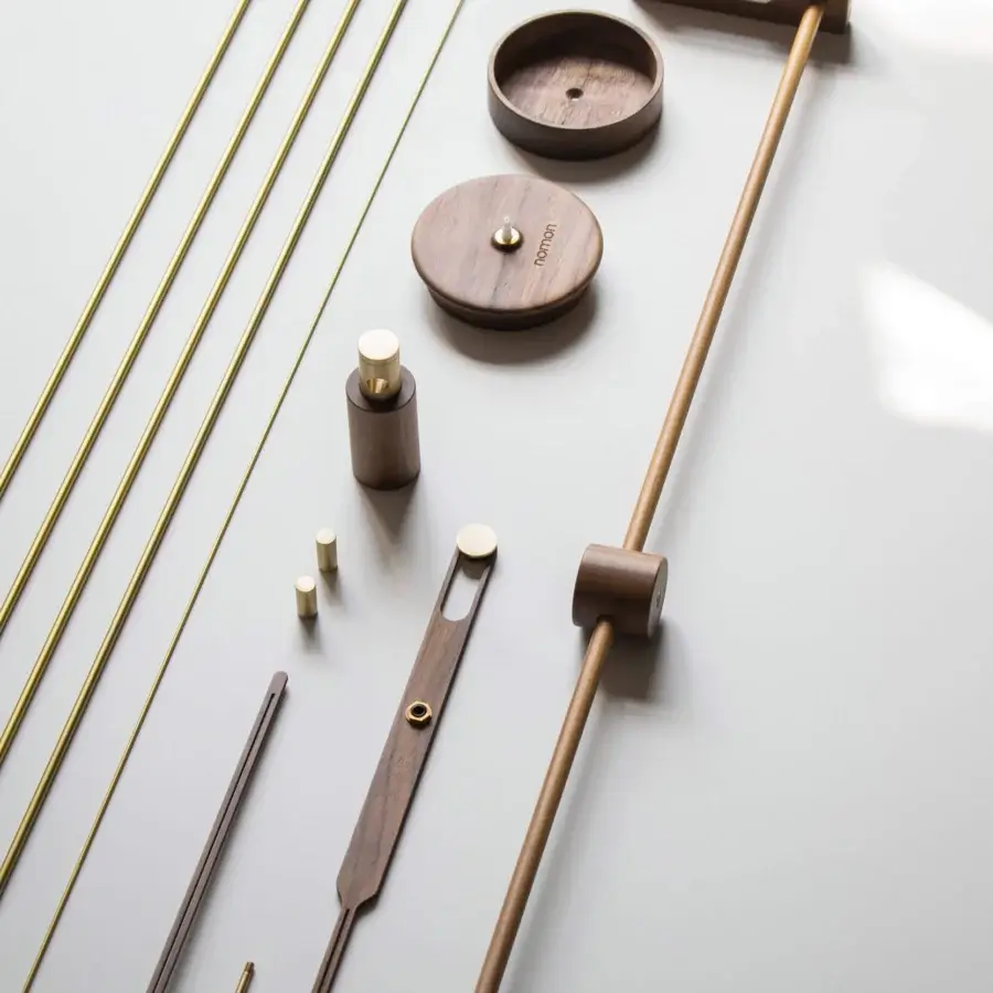 Exclusive Nomon Barcelona Premium wall clock crafted in wood with polished brass and satin finish