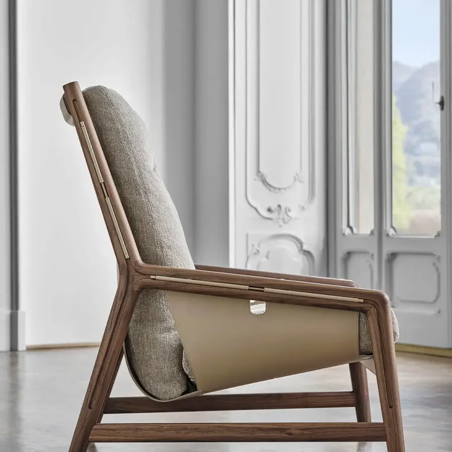 Lavish Porada Bice armchair with solid Canaletto walnut frame, light beige textile upholstery and warm tan Cuoietto leather armrests