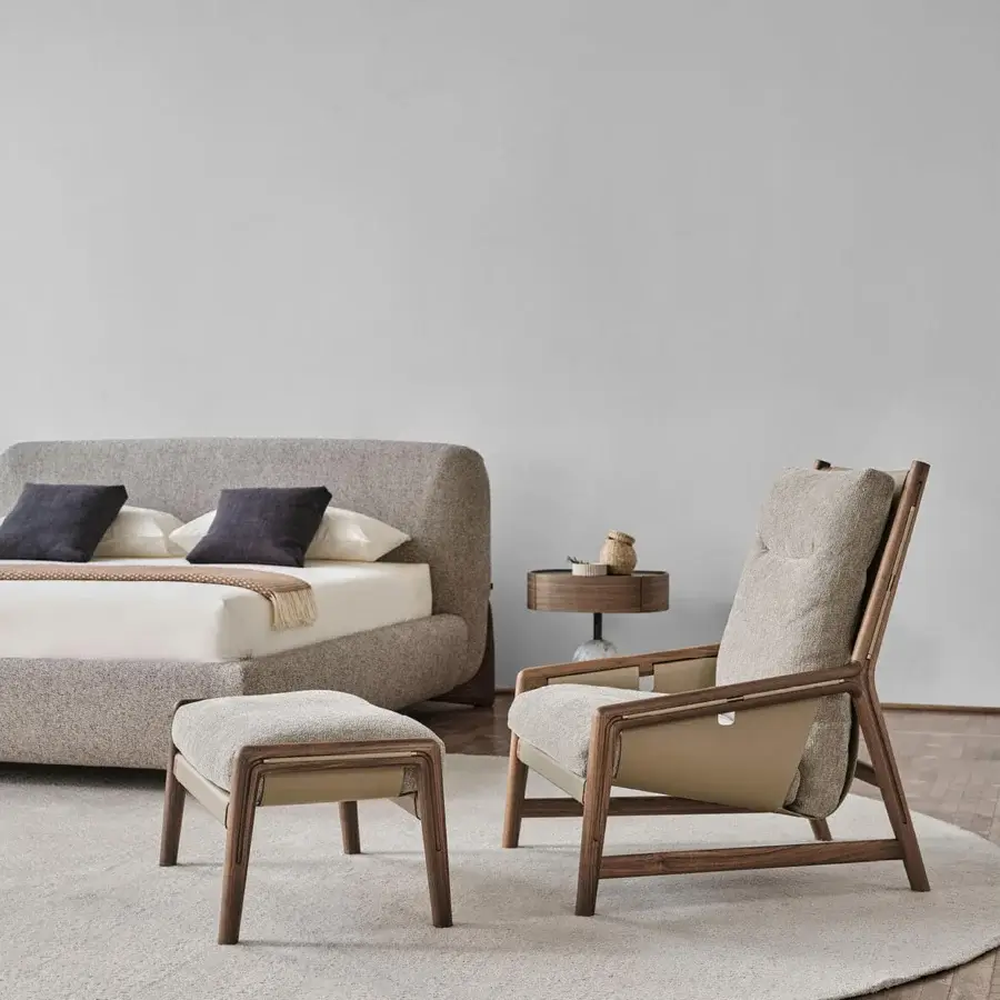 Lavish Porada Bice armchair with solid Canaletto walnut frame, Champagne metal details and textured gray Cuoietto leather upholstery