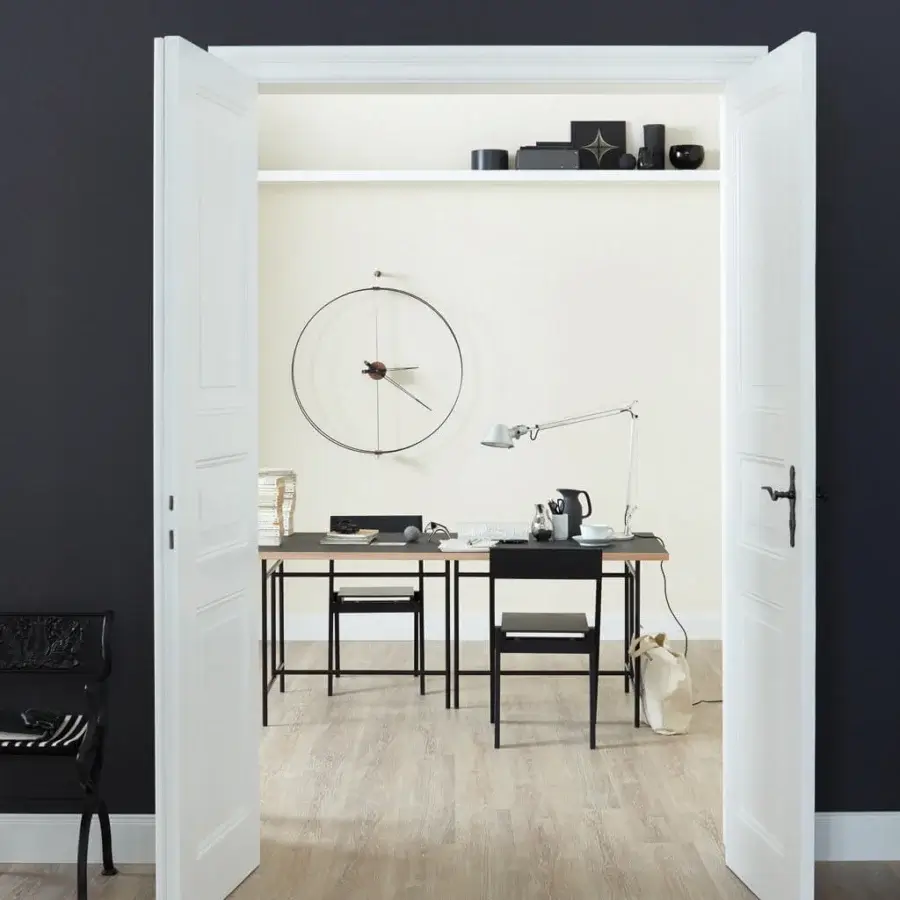 Elegant Nomon Mini Barcelona wall clock with double rings of black fiberglass and warm walnut components