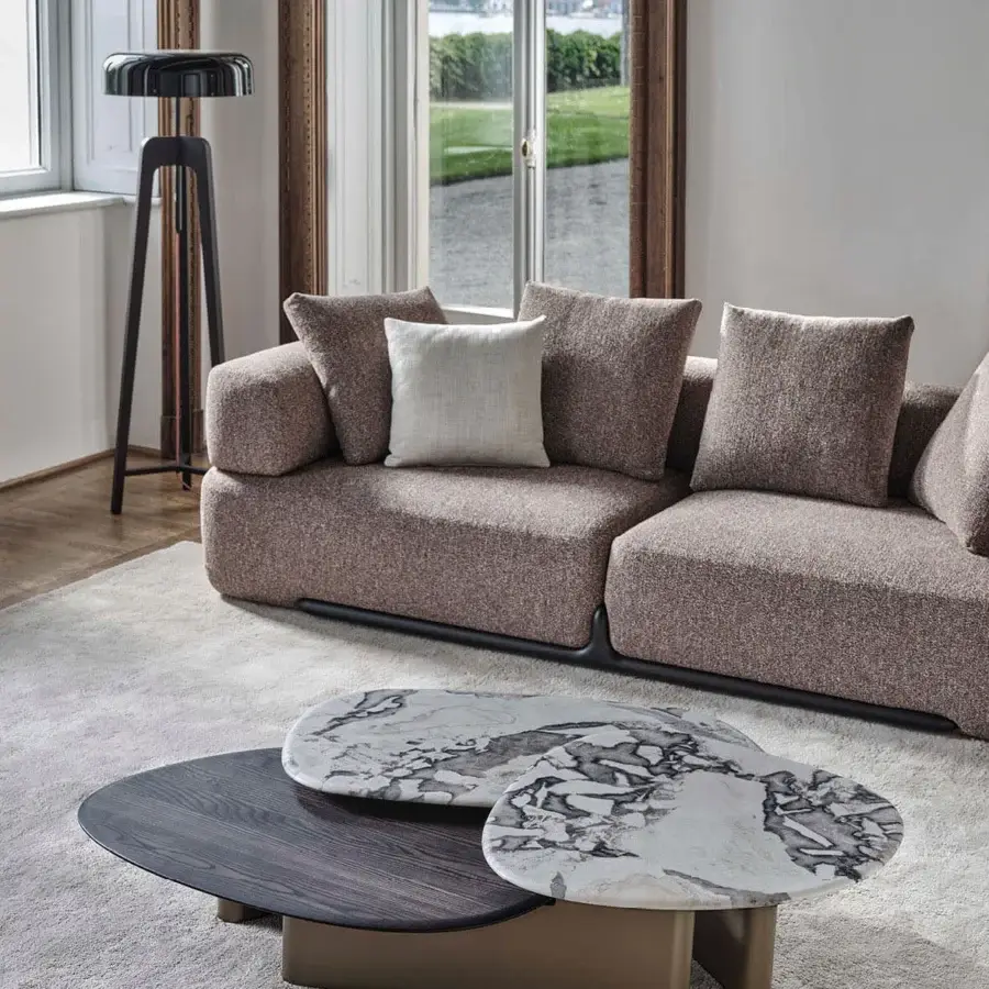 Distinguished Porada Callisto Mix coffee table with a Bronzoro-lacquered wooden base and Dover White marble sculptural tops displaying unique veining
