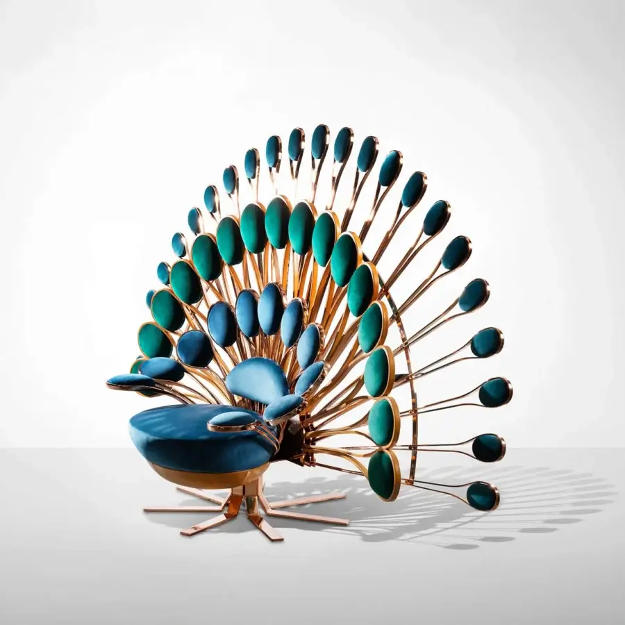 Luxury Visionnaire Pavone Throne lounge chair upholstered in deep teal fabric with a satin bronze cast brass backrest and leather base