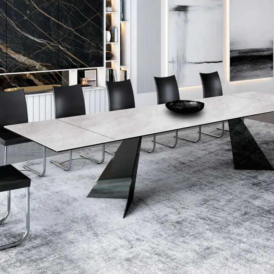 Elegant Naos Ingents table with light gray stone tabletop and dark metal base exhibiting a matte finish