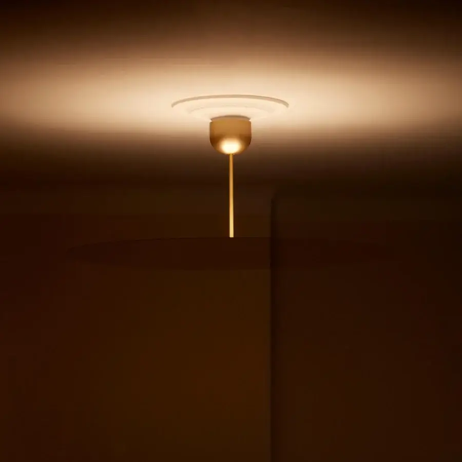 Exceptional Luceplan Millimetro suspension lamp crafted in metal with a satin gold finish and upward illumination