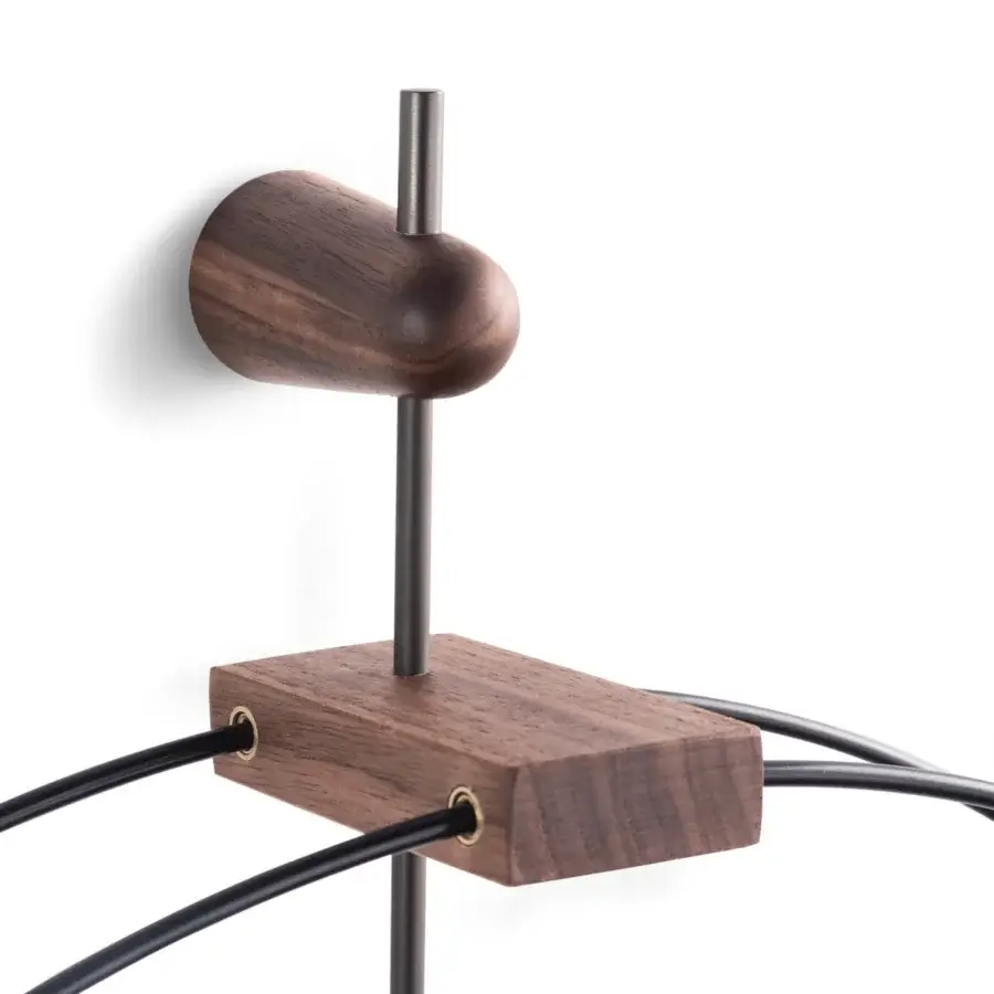 Superior Nomon Micro Barcelona wall clock with black fiberglass framing elegant walnut elements in satin finish