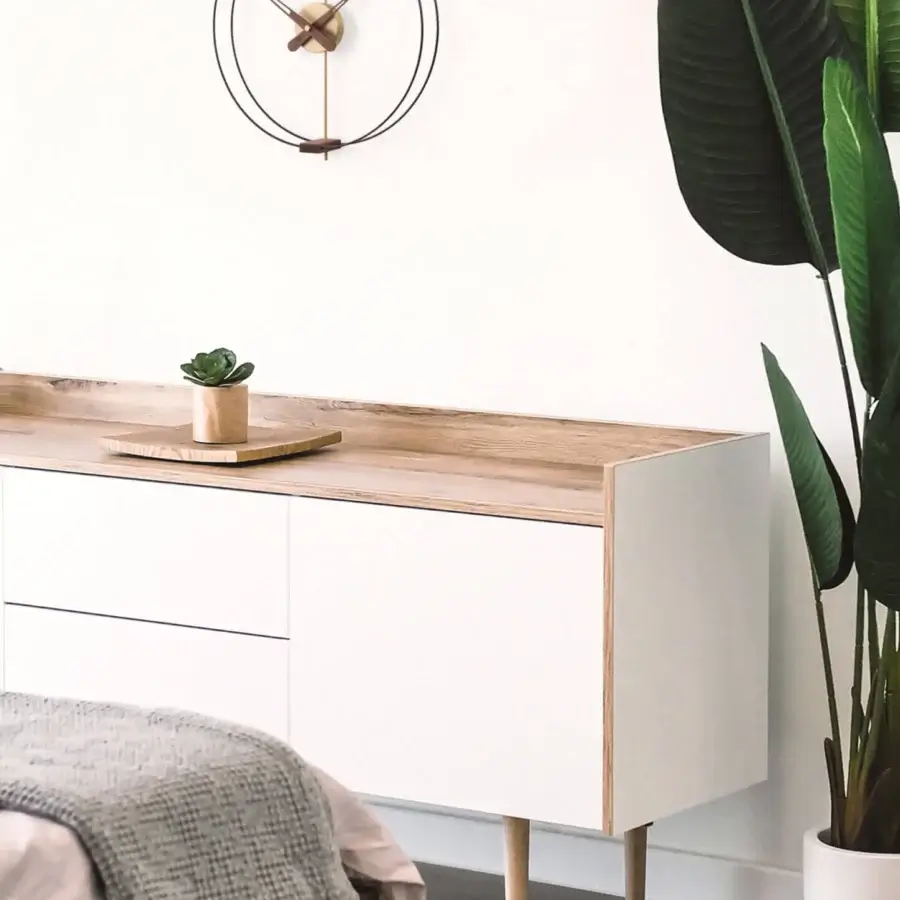Superior Nomon Micro Barcelona wall clock with a black fiberglass double ring and fine walnut elements in a satin finish