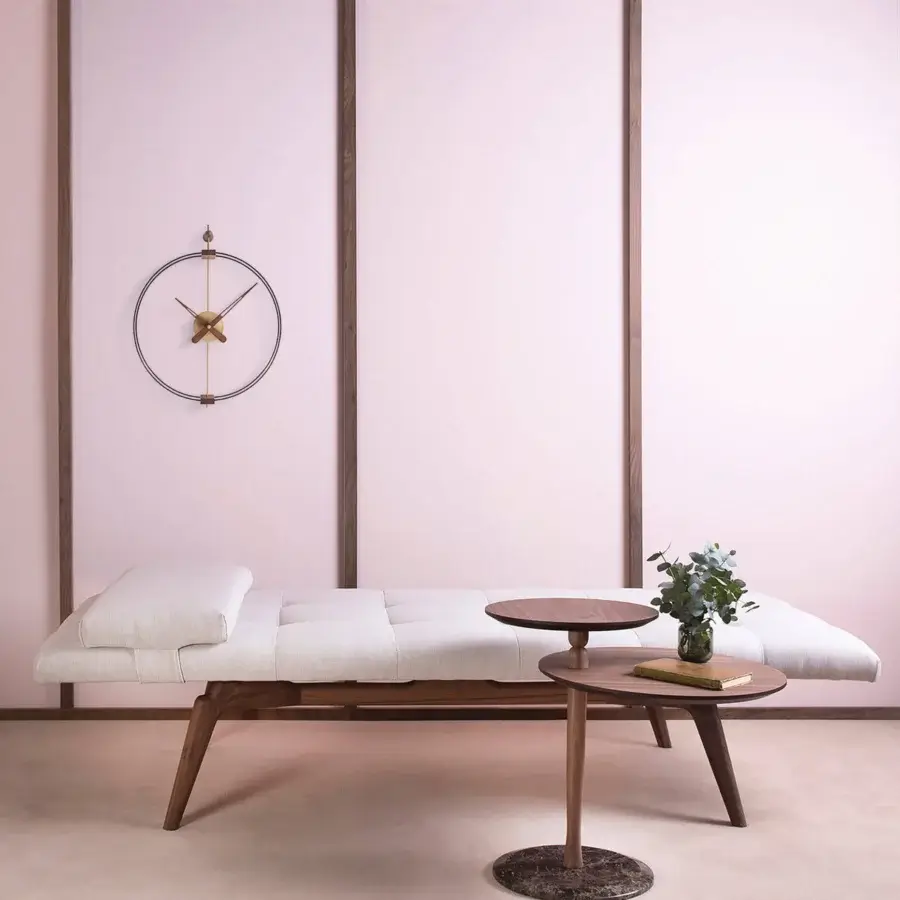 Distinguished Nomon Micro Barcelona wall clock with a black fiberglass double ring framing walnut elements and fine metal details
