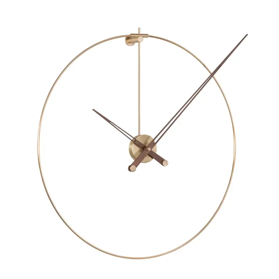 Superior Nomon New Anda wall clock with purity of form and suspended satin gold-toned metal design