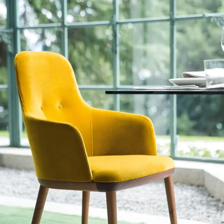 Superior Porada Connie chair with vibrant yellow velvet upholstery and Canaletta Walnut wood frame with satin finish
