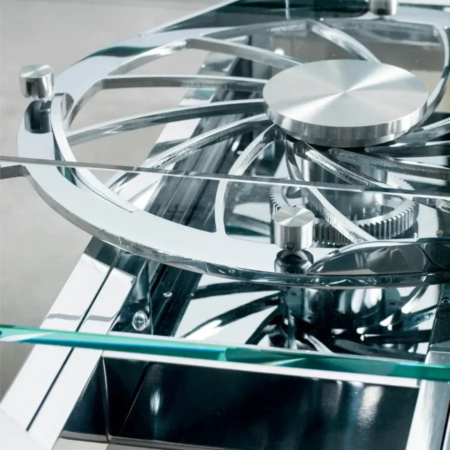 Exceptional Naos Quasar table crafted with stratified glass legs and a polished silver finish glass top