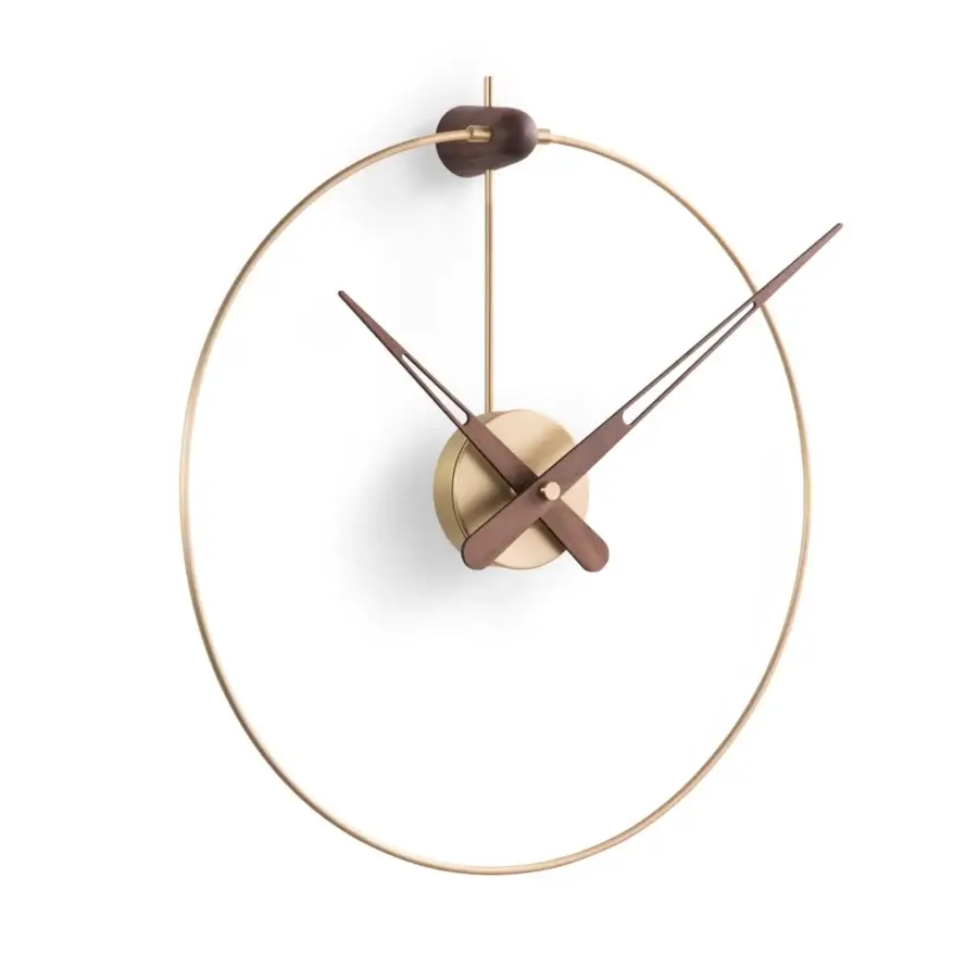 Superior Nomon Micro Anda wall clock with a gold-toned metallic ring and contrasting walnut wood hands crafted in a smooth finish