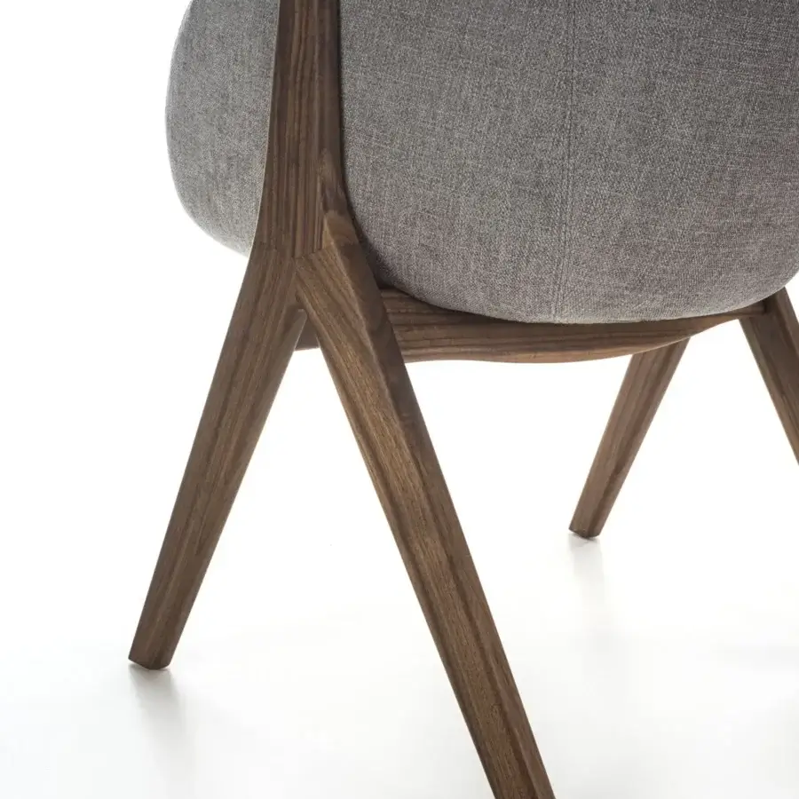 Refined Porada Lambda armchair with solid canaletta walnut frame and subtly textured gray textile upholstery with satin finish