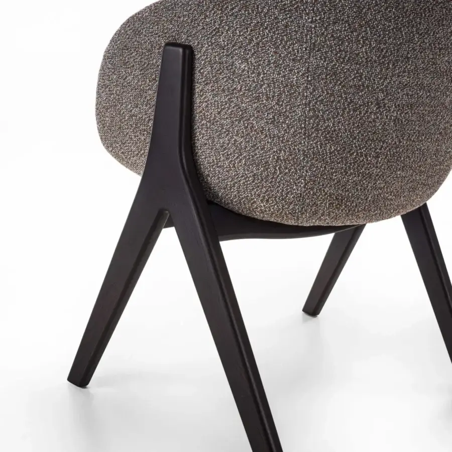 Distinctive Porada Lambda armchair with complex gray-brown textile upholstery and solid canaletta walnut frame