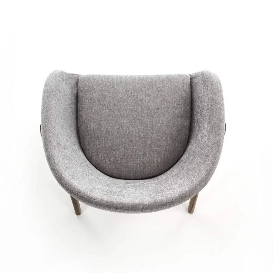 Superior Porada Lambda armchair with rounded silhouette, textured medium gray fabric upholstery and solid canaletta walnut frame
