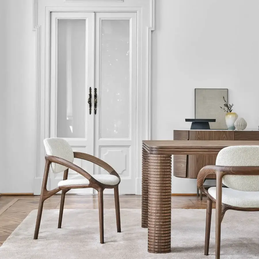 Exceptional Porada Molly armchair with a continuous canaletto walnut frame and light beige upholstery in a satin finish