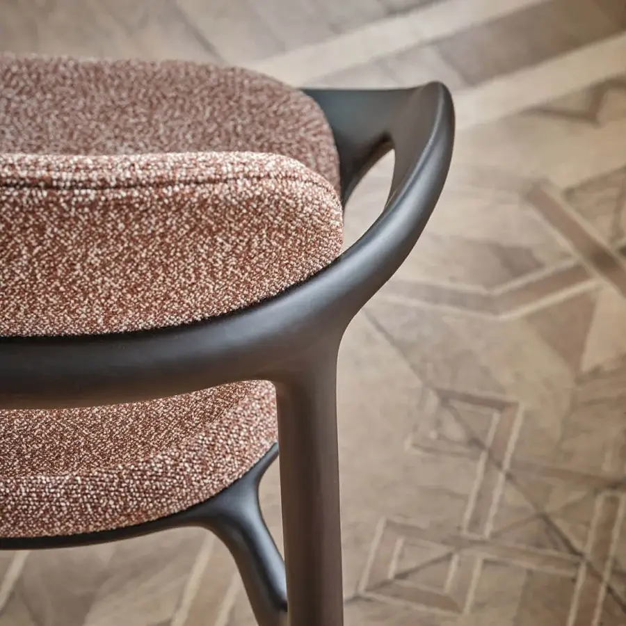 Elegant Porada Molly armchair with a continuous canaletto walnut frame and reddish-brown beige textile upholstery with a satin finish